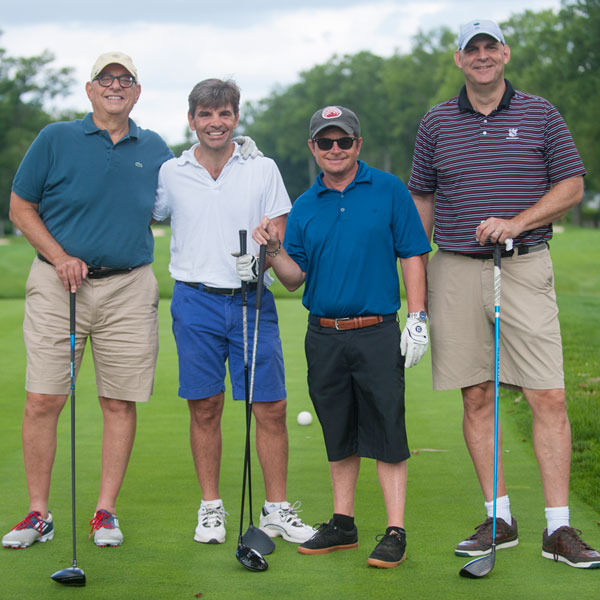 Michael joins golf buddies Harlan Coben and George Stephanopoulos, along with his agent Peter Benedek (left), at Breaking PAR, the annual golf event and fundraiser for The Michael J. Fox Foundation.