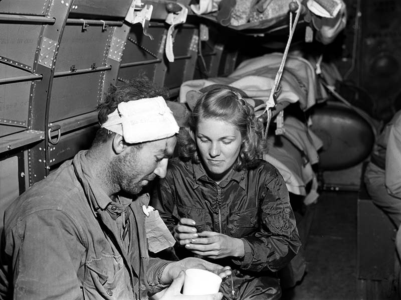 Flight Nurse with Wounded Soldier-WWII